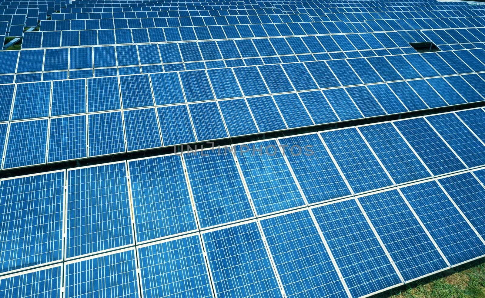 Aerial view of Solar Panels Farm Solar Cell Station. Production of clean energy. Renewable green alternative energy concept.