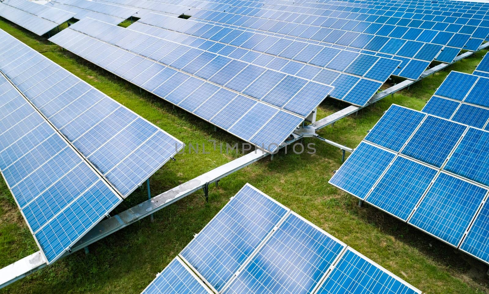 Aerial view of Solar Panels Farm Solar Cell Station. Production of clean energy. Renewable green alternative energy concept.