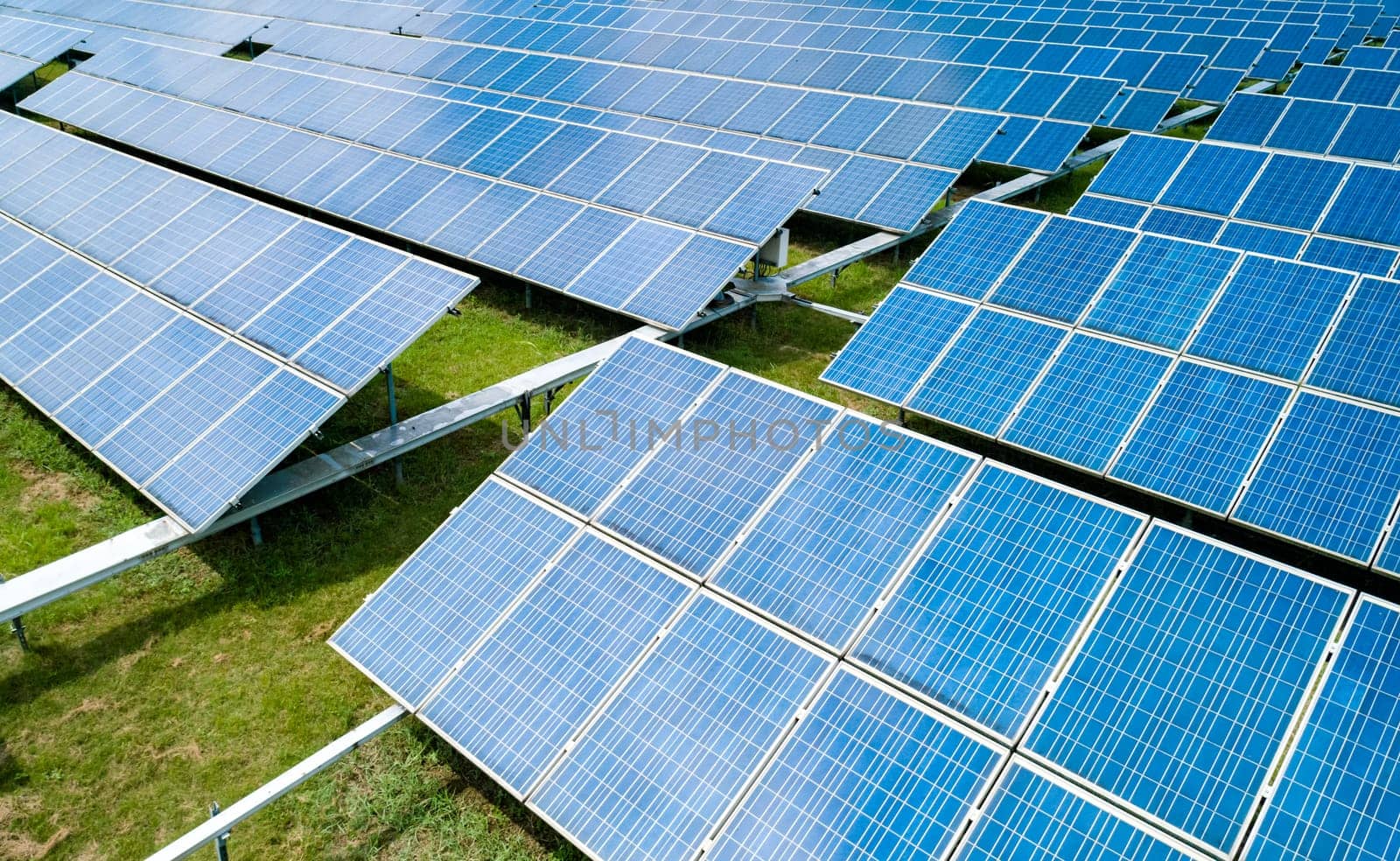 Aerial view of Solar Panels Farm Solar Cell Station. Production of clean energy. Renewable green alternative energy concept. by Busker