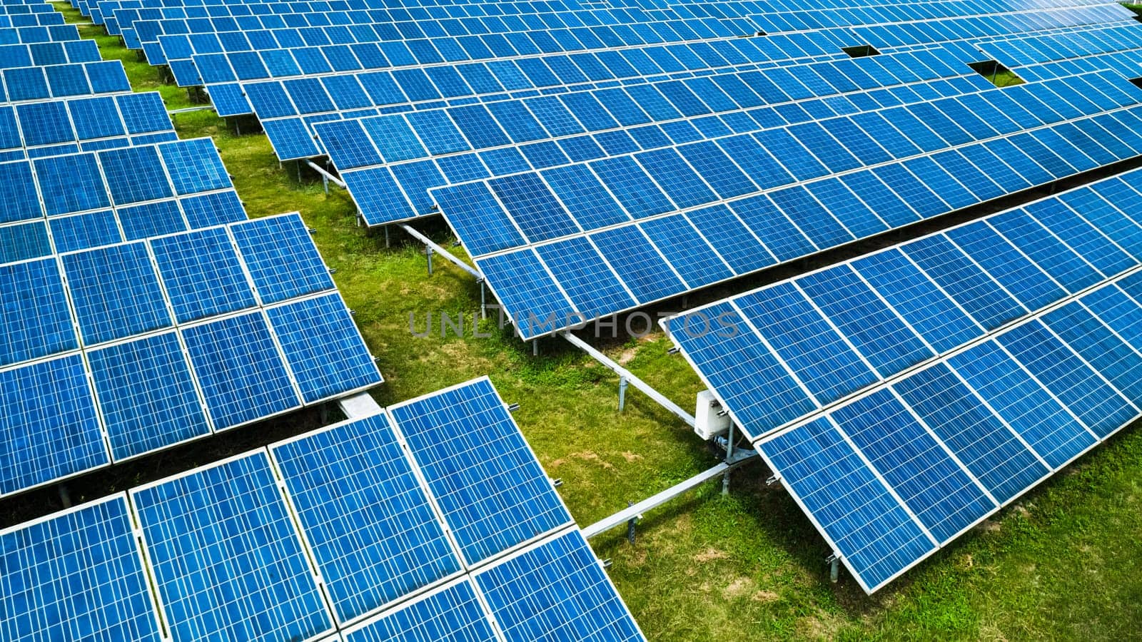 Aerial view of Solar Panels Farm Solar Cell Station. Production of clean energy. Renewable green alternative energy concept.