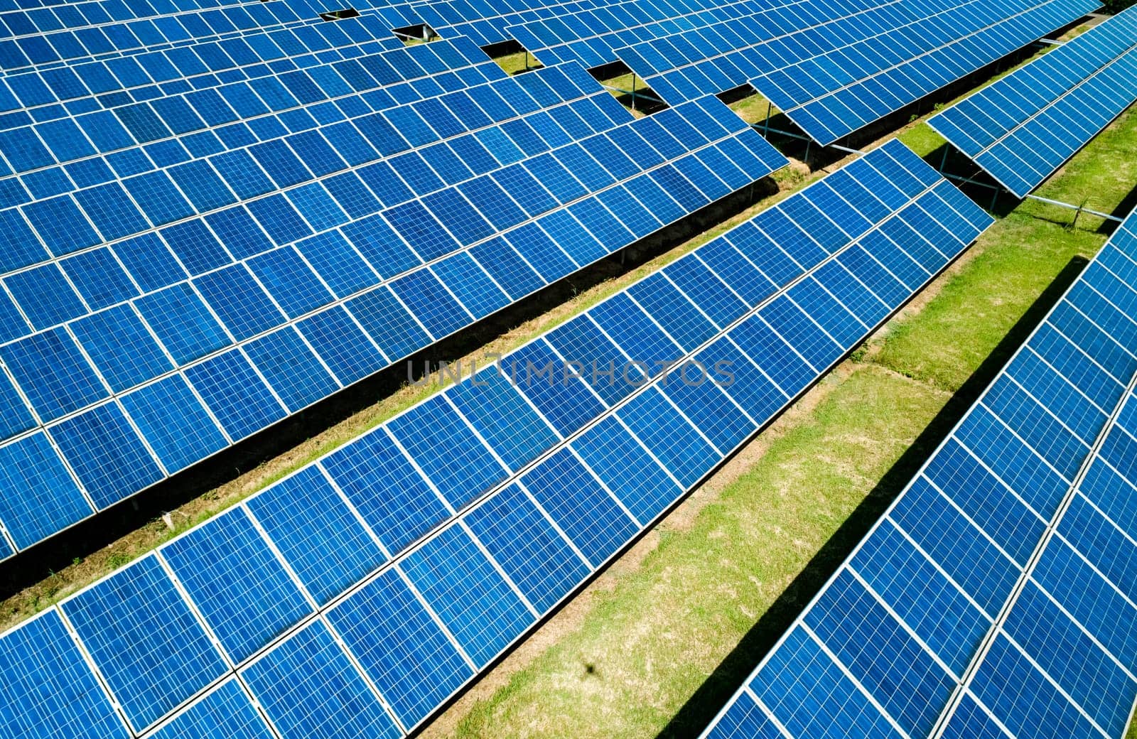 Aerial view of Solar Panels Farm Solar Cell Station. Production of clean energy. Renewable green alternative energy concept.