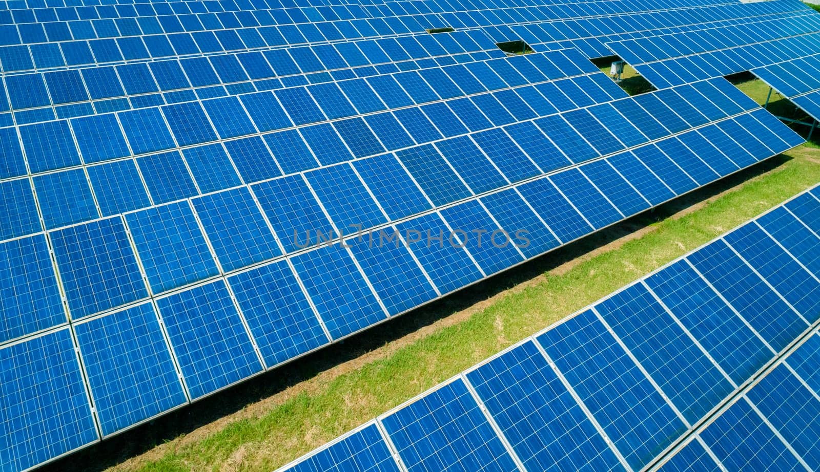 Aerial view of Solar Panels Farm Solar Cell Station. Production of clean energy. Renewable green alternative energy concept.