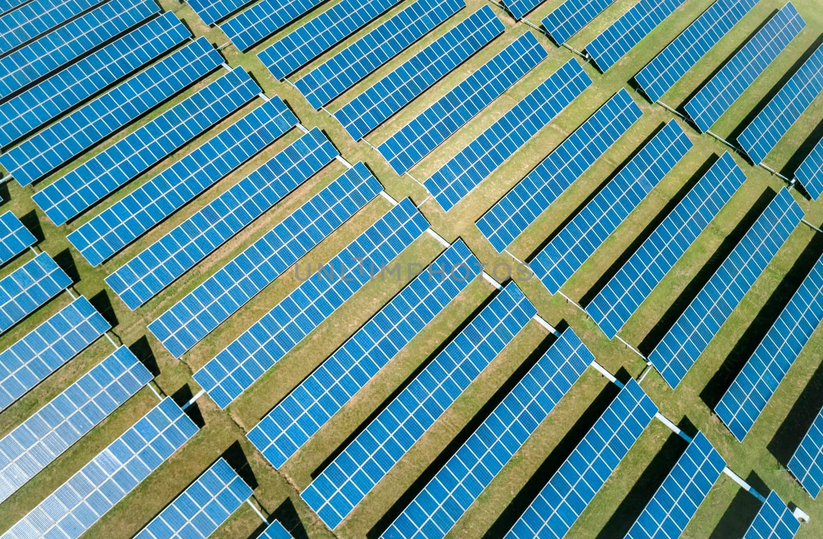 Aerial view of Solar Panels Farm Solar Cell Station. Production of clean energy. Renewable green alternative energy concept.