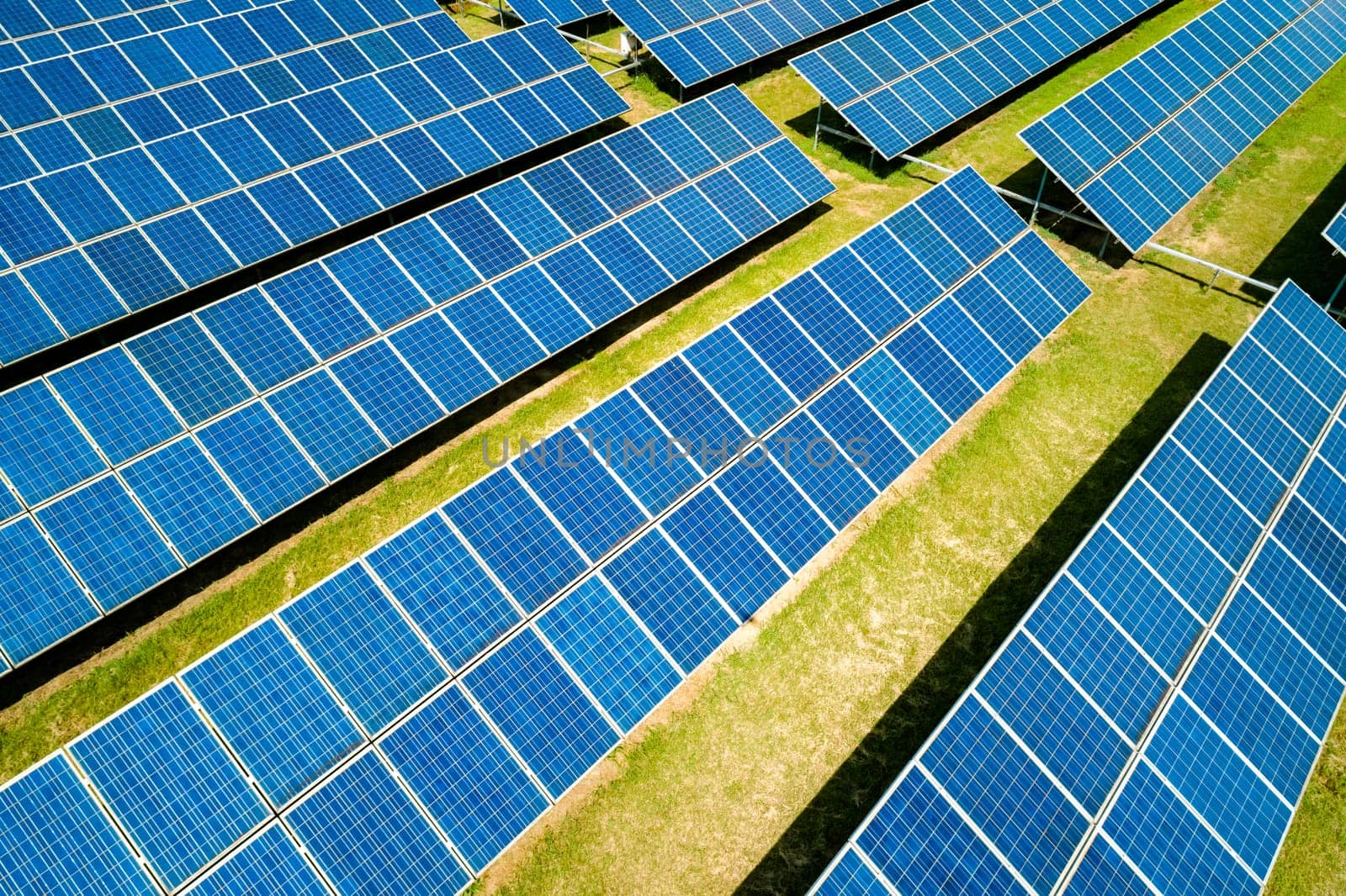 Aerial view of Solar Panels Farm Solar Cell Station. Production of clean energy. Renewable green alternative energy concept.