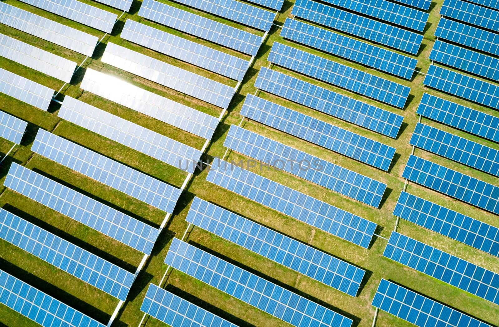 Aerial view of Solar Panels Farm Solar Cell Station. Production of clean energy. Renewable green alternative energy concept.