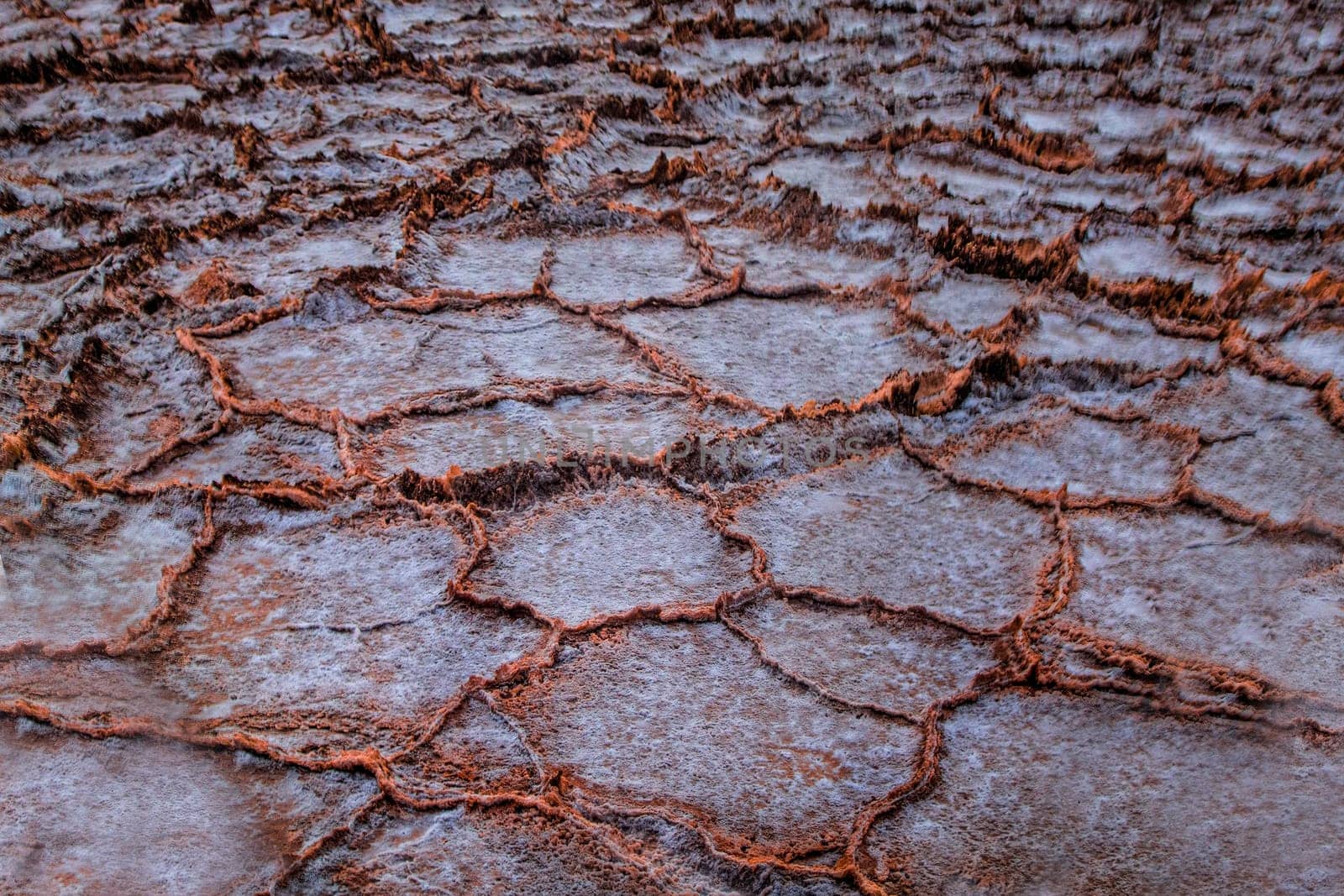 The salt flats at sunset at Badwater Basin at Death Valley National Park, California