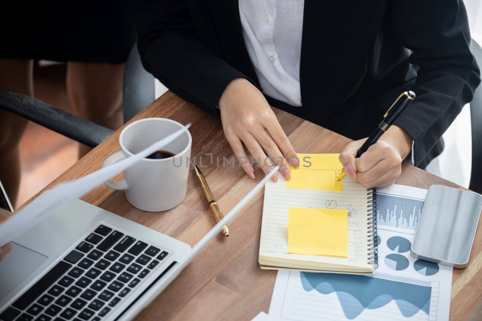 Diverse group of business analyst team analyzing financial data report paper on office table. Chart and graph dashboard by business intelligence analysis for strategic marketing planning Meticulous