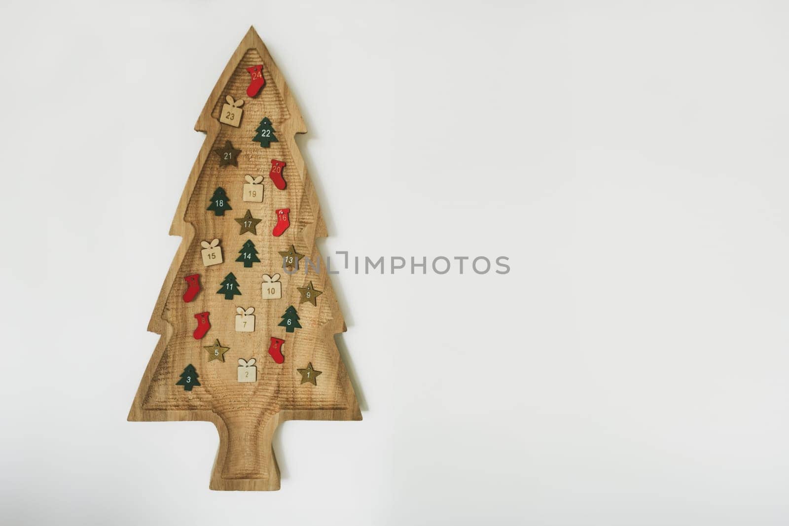 Wooden Christmas tree with hanging 24 numbers Advent calendar