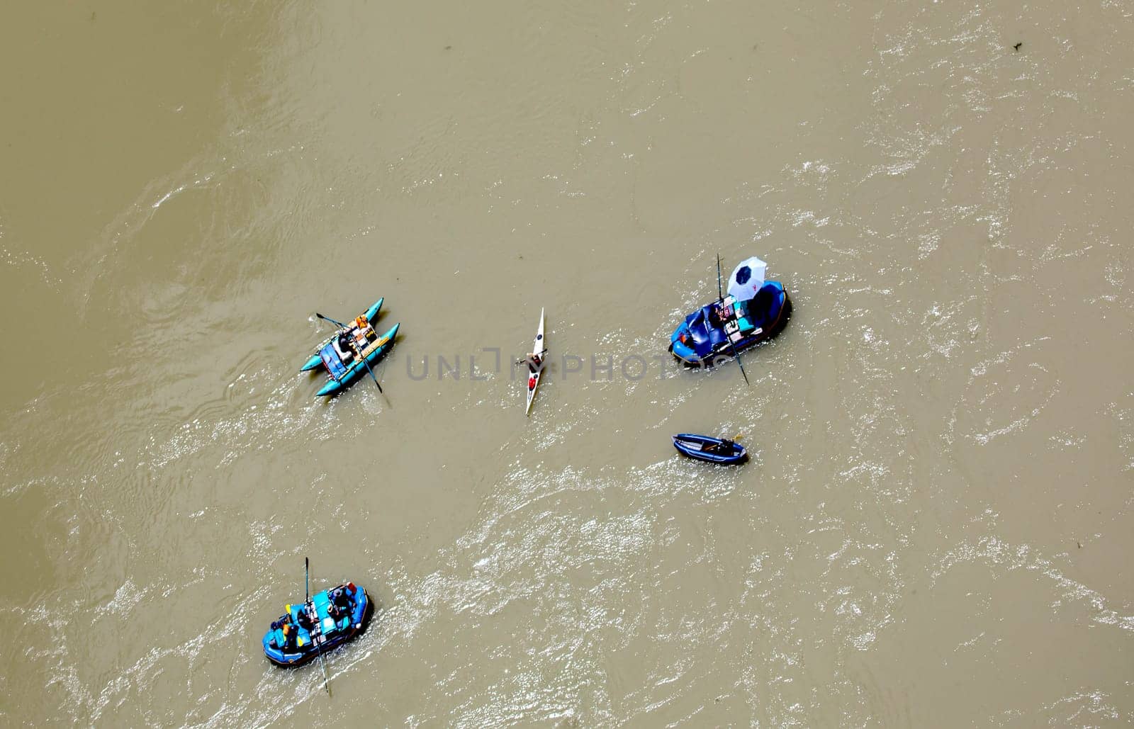 Rafters make their way down the Colorado River at Lee's Ferry, Arizona