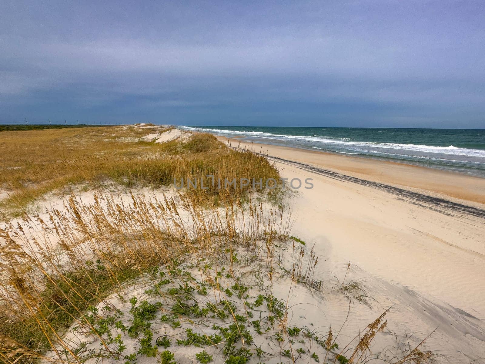 Sand Dunes and Ocean Waves make up the scene at Cape Hatteras National Seashore, North Carolina