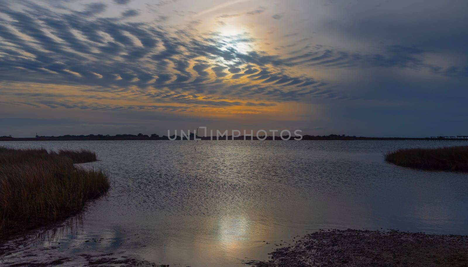 The sun sets on Oregon Inlet at Cape Hatteras National Seashore, North Carolina