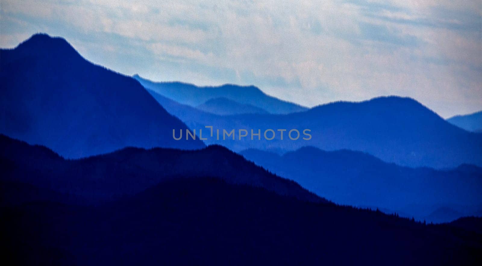 Ridgelines of the mountains of New Hampshire at dusk.