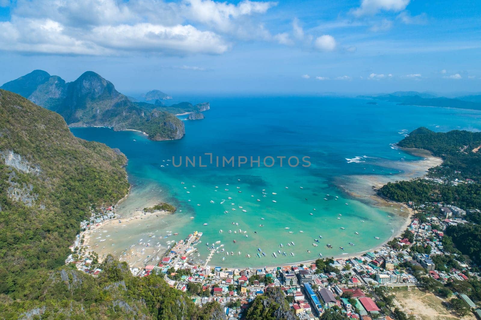 Aerial view over mountain with tropical lagoon on the background on sunny day. El Nido, Palawan.