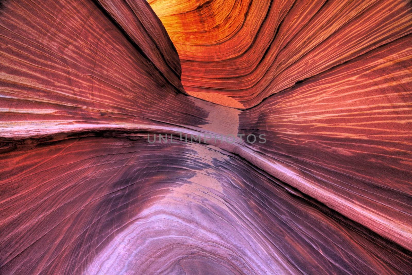 Parallel lines in the slickrock make up the landscape at The Wave at Coyote Buttes North at the Vermillion Cliffs National Monument in Arizona