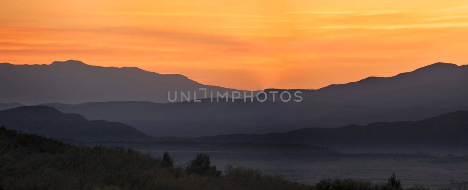 The sun sets beyond the Pine Valley Mountains in Southern Utah