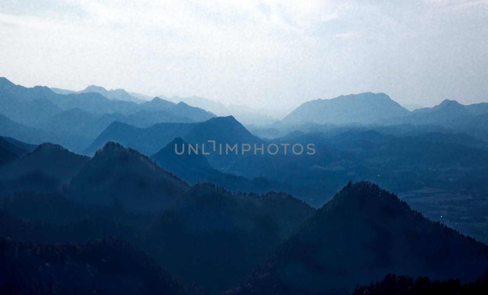 Haze and fog envelope the mountain ridgelines along Virginia's Blue Ridge Parkway.