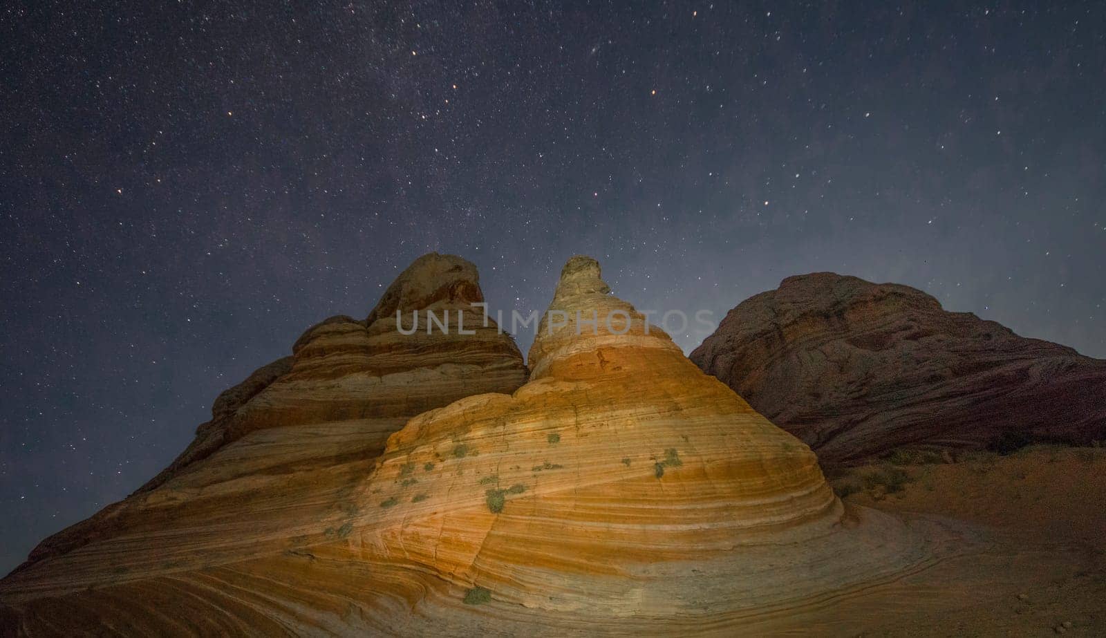 The stars appear over White Pocket at Vermilion Cliffs National Monument, Arizona