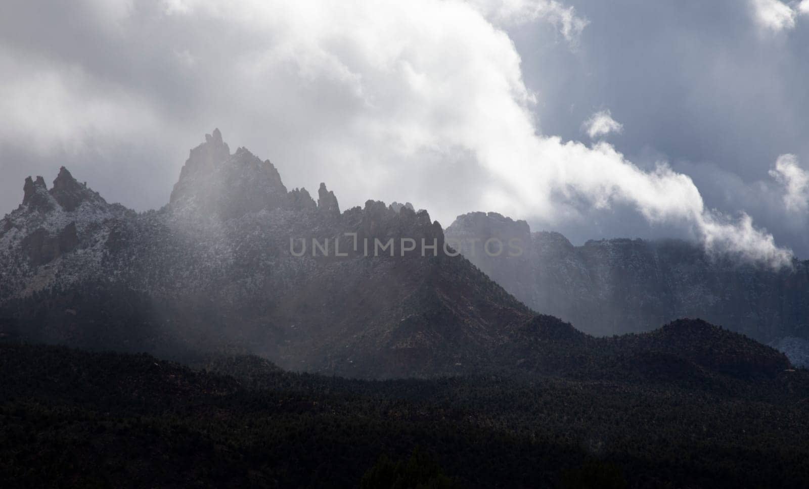 Rain clouds pass through Eagle Crags just outside Zion National Park, Utah