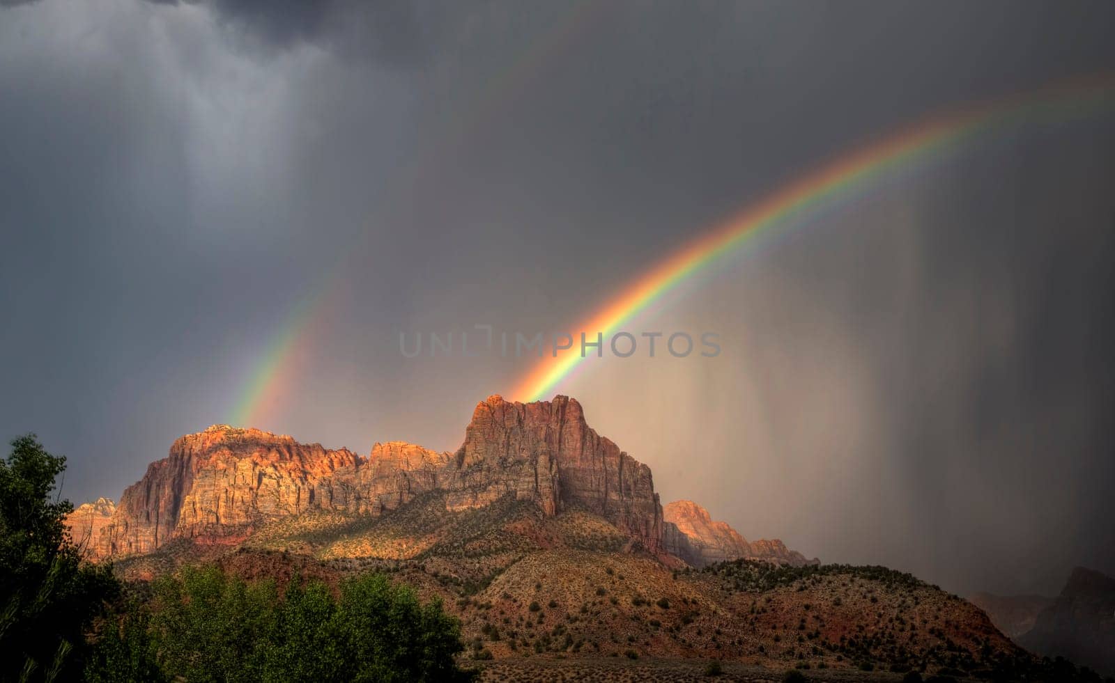 A rainbow appears during a monsoonal thunderstorm at Zion National Park, Utah