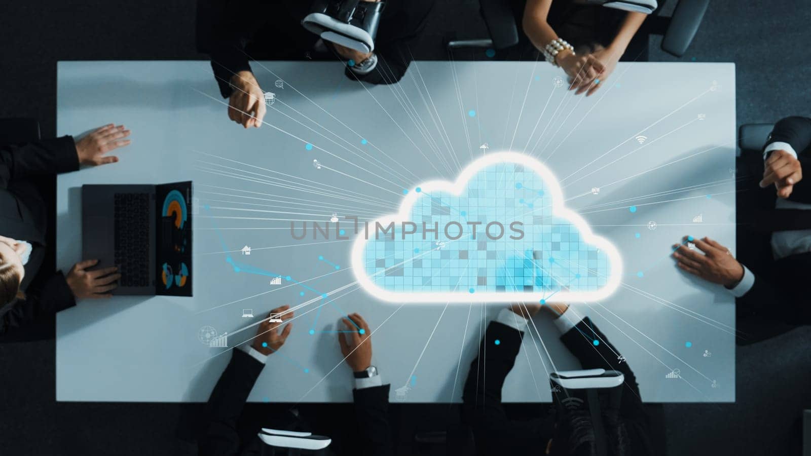 Top down aerial view of data analysts wearing VR headsets stands around holographic of a cloud server. Business people using hand gestures to manipulate the data from manager laptop. . Directorate.