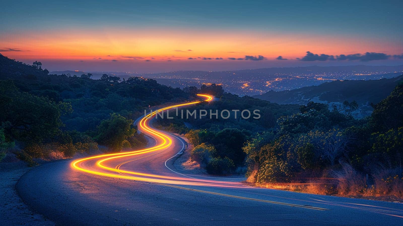 Light trails on mountain road at night, illustrating motion and journey.