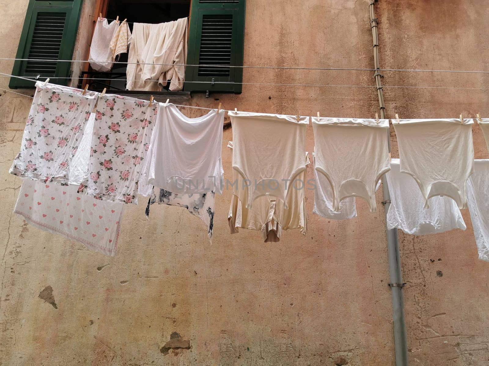 clothes hanging to dry in italian pictoresque village of cinque terre