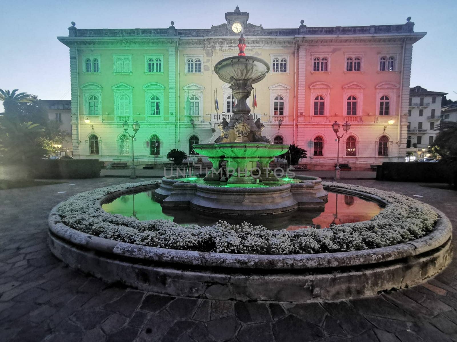 alassio italy city hall illuminated at night red green and white