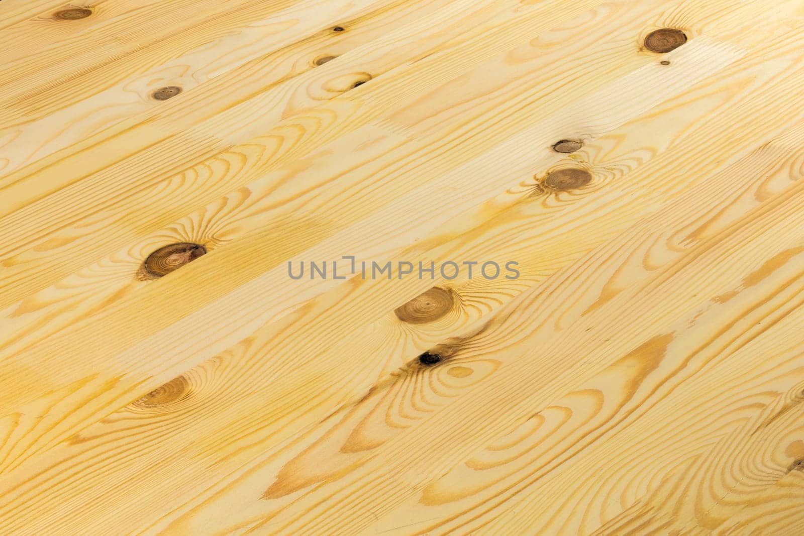 hardwood flooring plank solid glued board, full-frame background with diagonal composition.