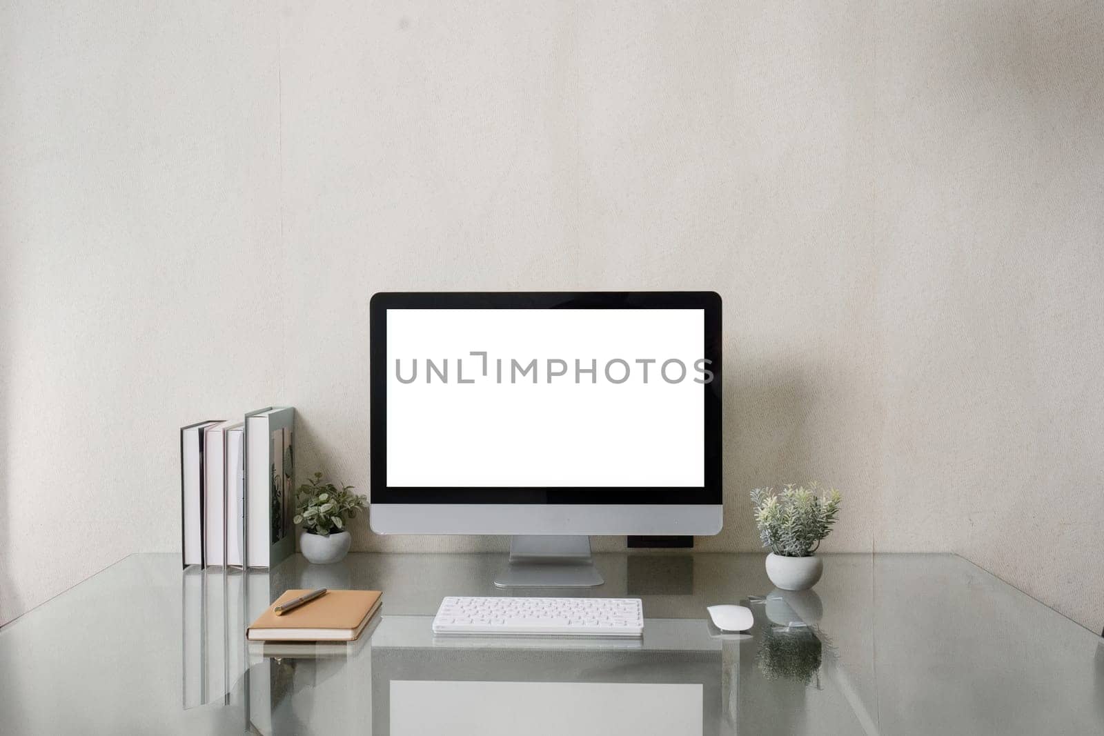 Blank screen desktop computer in minimal office room with decorations and copy space by itchaznong