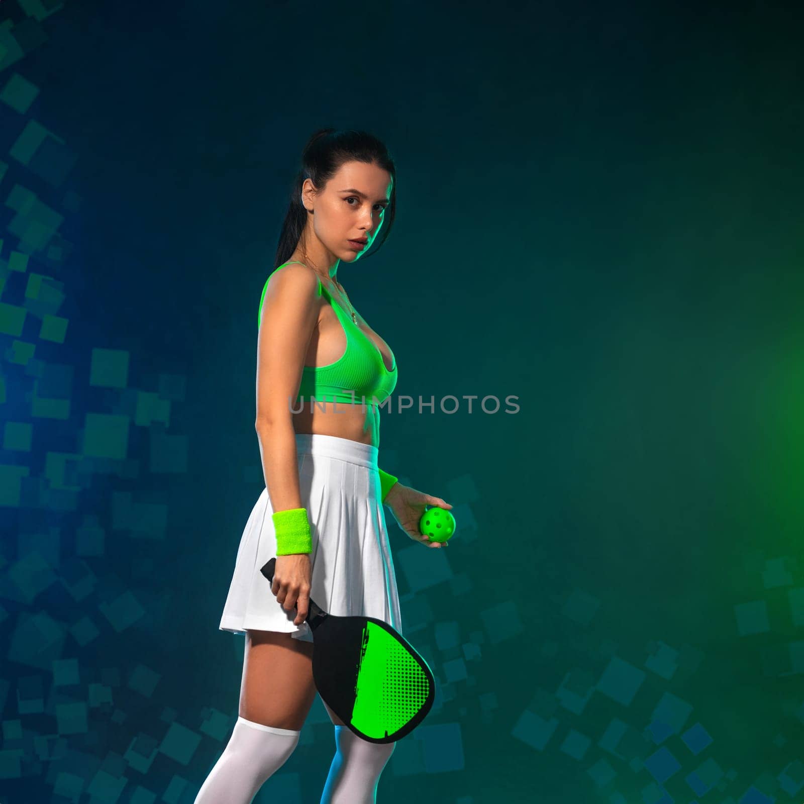Pickleball tennis player with racket on the court. Sport court and balls. Download a high quality photo with paddle for the design of a sports app or social media advertisement