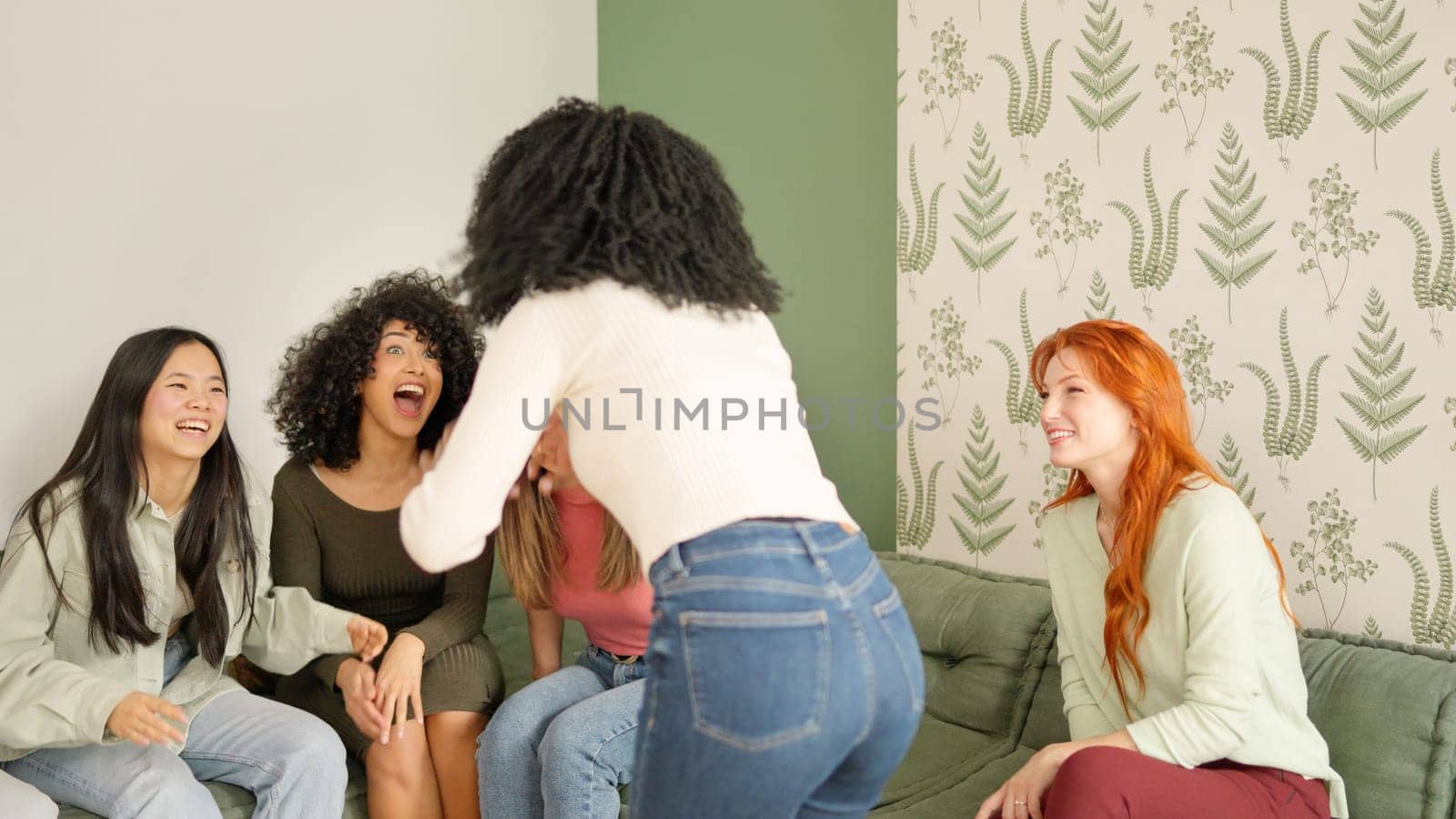 Young Woman explaining a funny story to a group of multi-ethnic friends