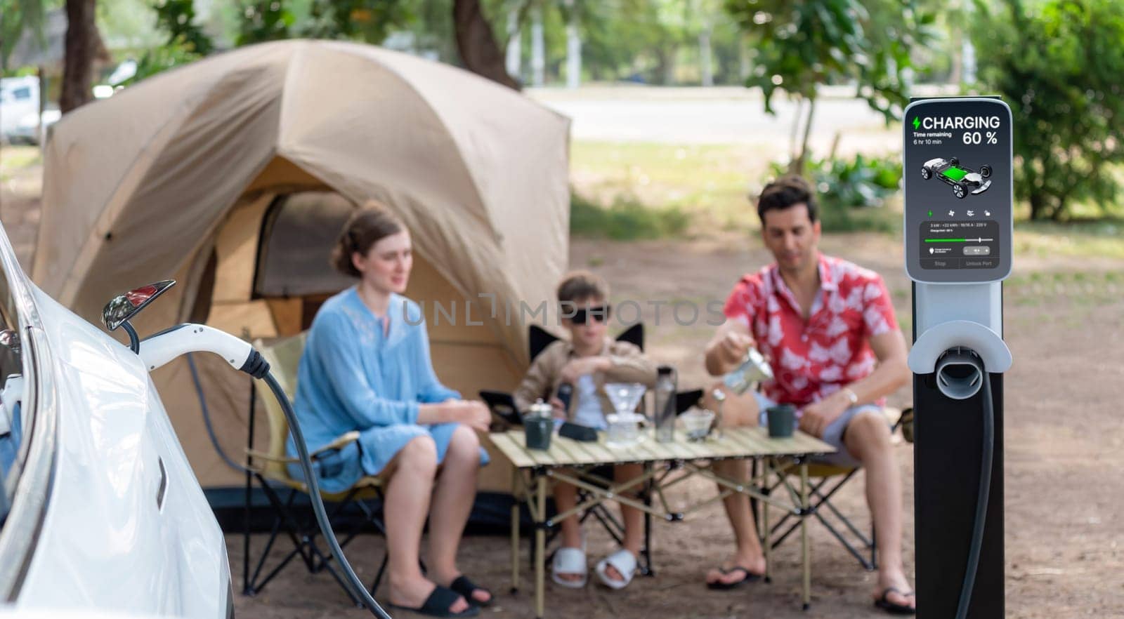 Outdoor adventure and family vacation camping in nature travel by eco friendly car for sustainable future. Lovely sit on trunk, charging EV car with EV charging station in campsite. Panorama Perpetual