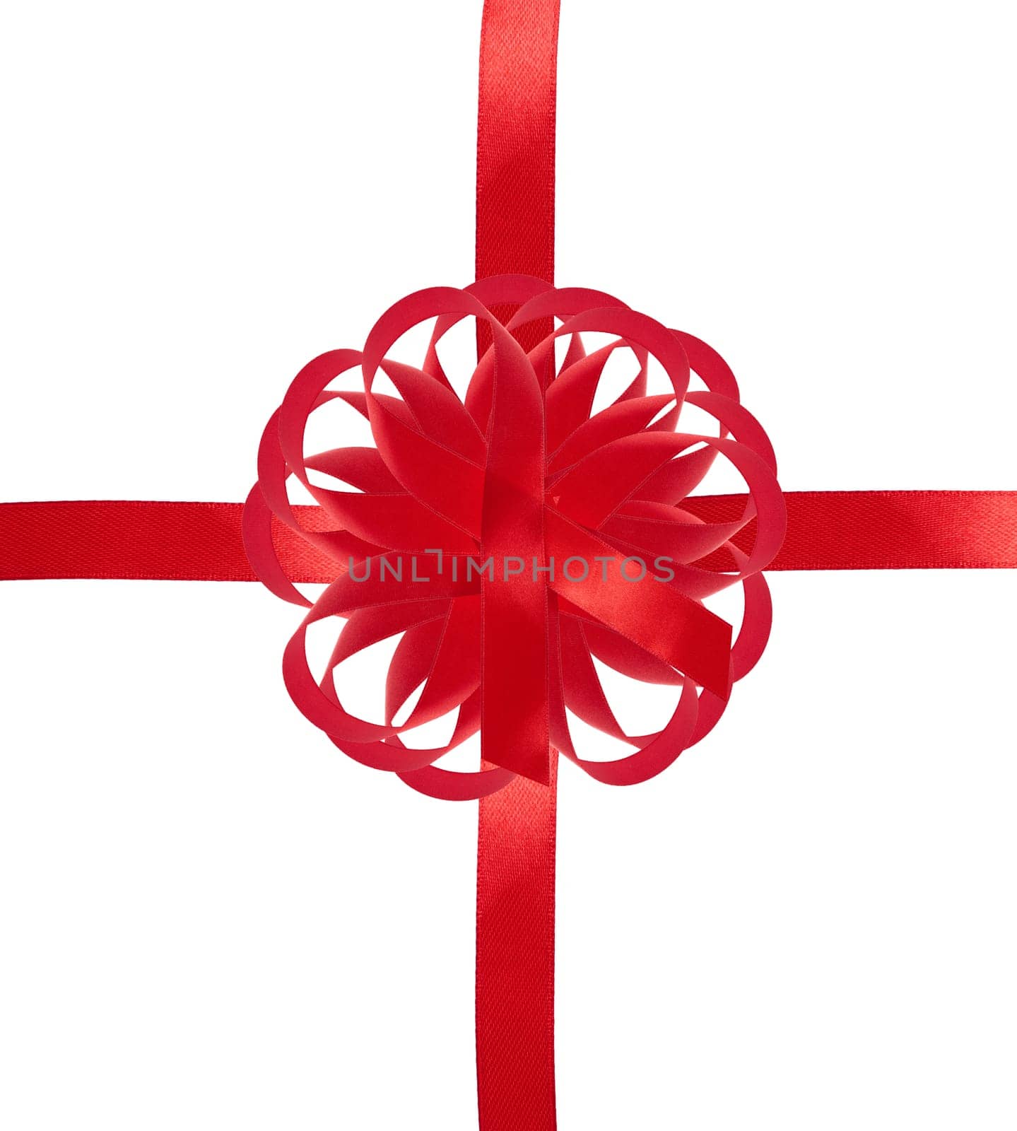 Red ribbon with a cross and a bow on an isolated background, packaging for a gift