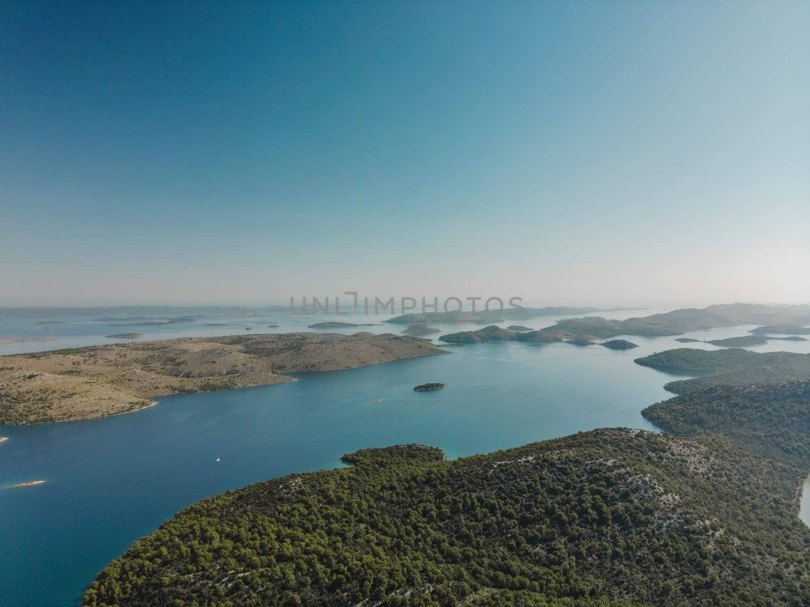 Drone high aerial view of Telascica bay and epic rocky lands with green pine forest in National Park, Croatia