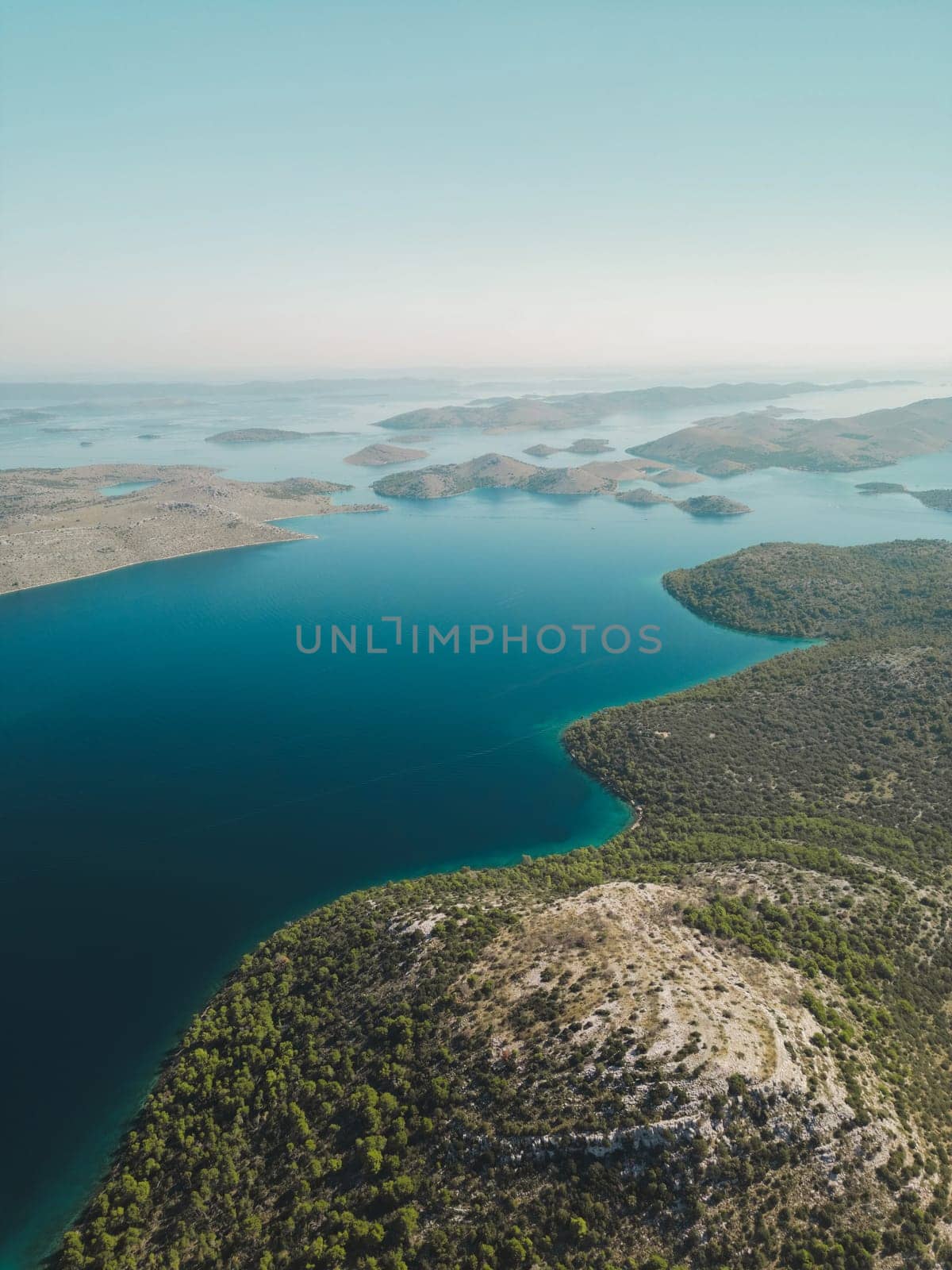 Drone view of blue sea and group of picturesque islands with mountains in Telascica National Park, Croatia