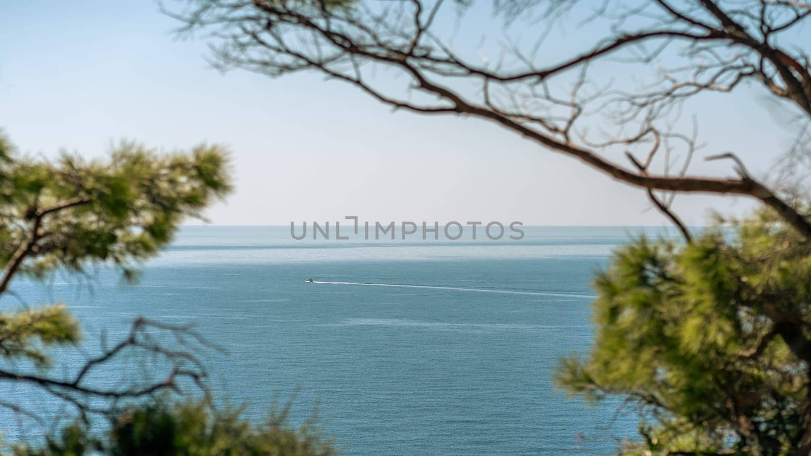 Motor boat sailing on blue sea waves in picturesque Telascica bay in Croatia. Selective focus