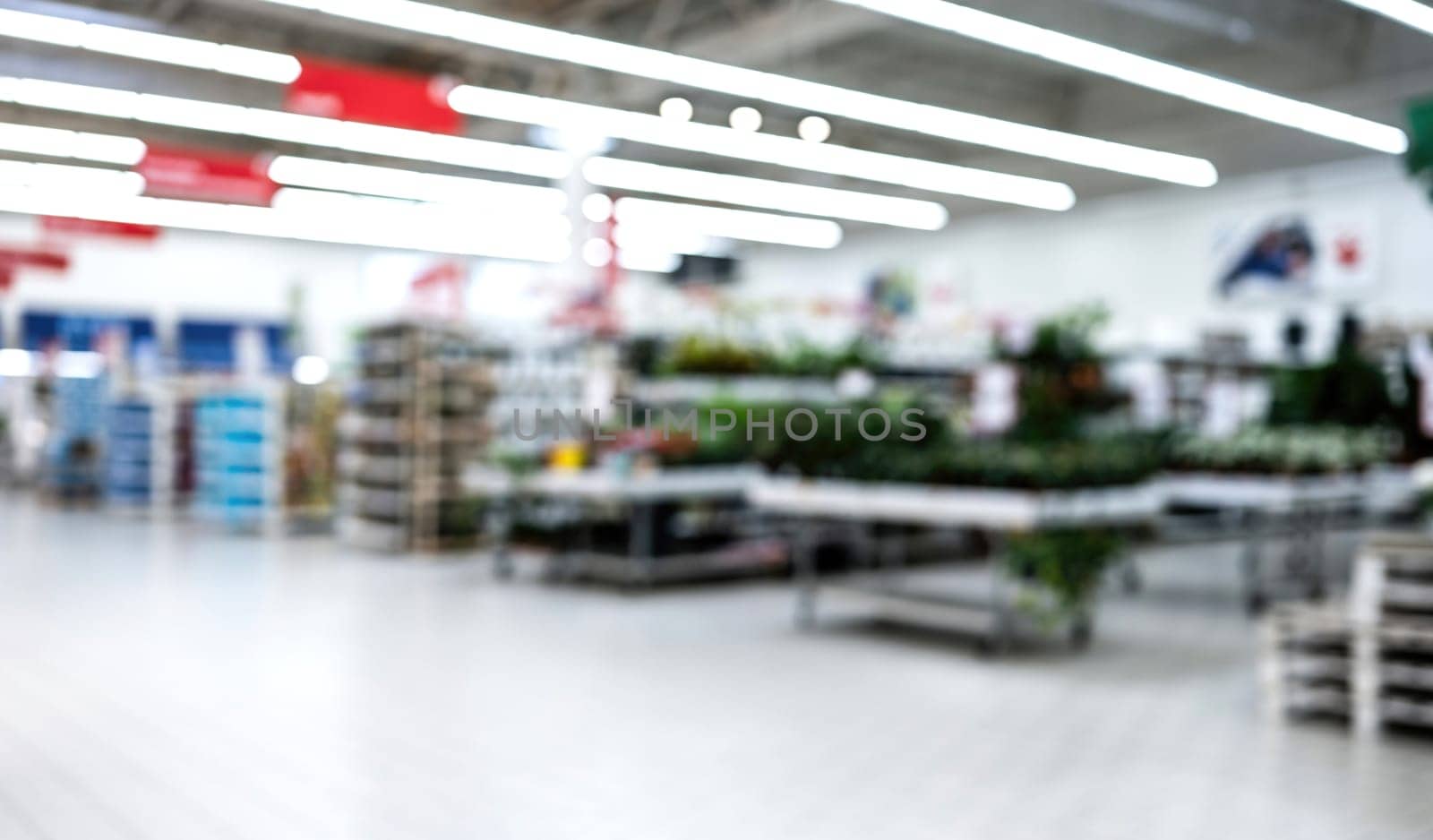 Blurred Interior Of Household Supermarket With Goods For The Home