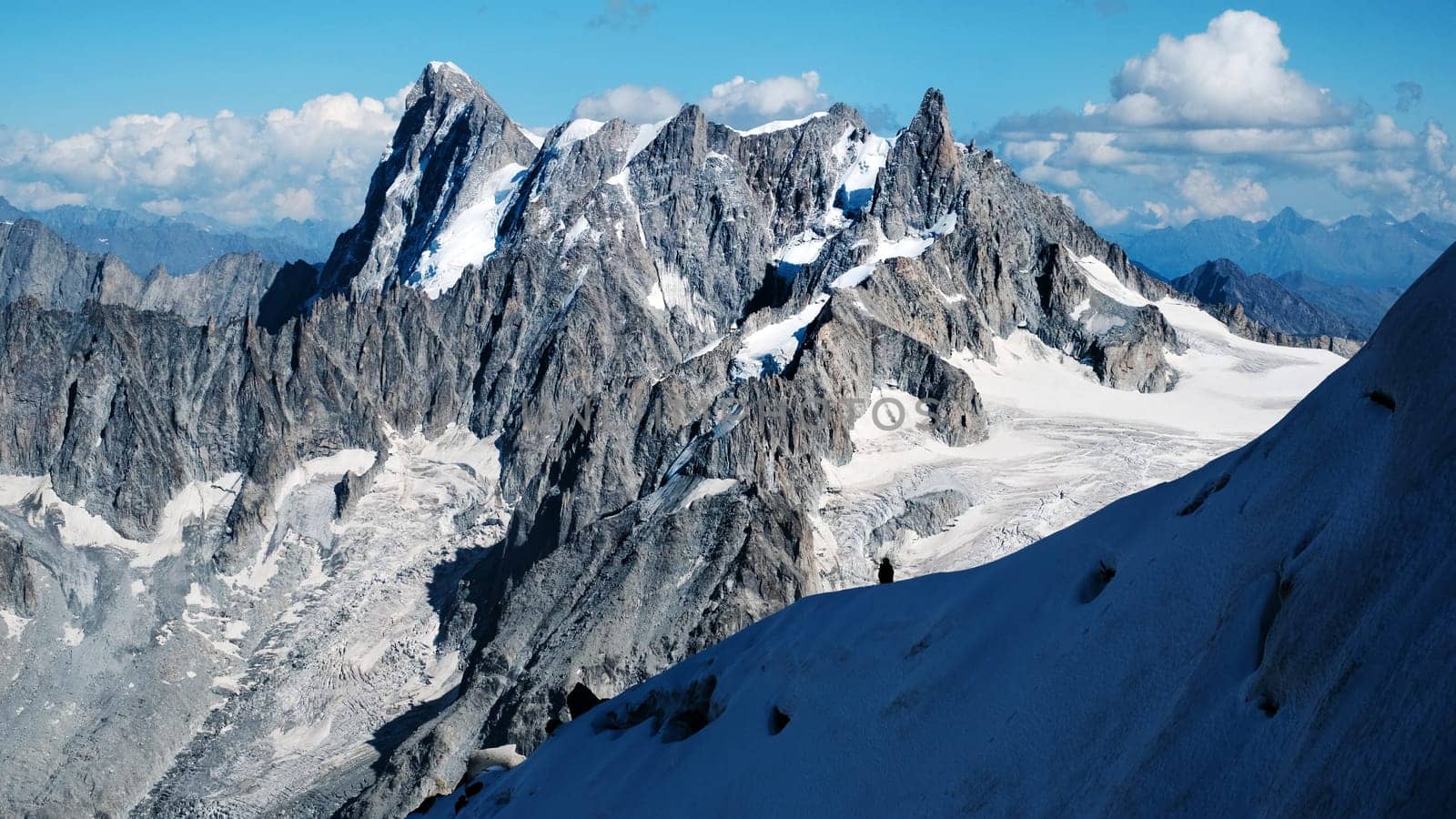 Group Of Alpinists Climbing The Montblanc Snowy Mountain