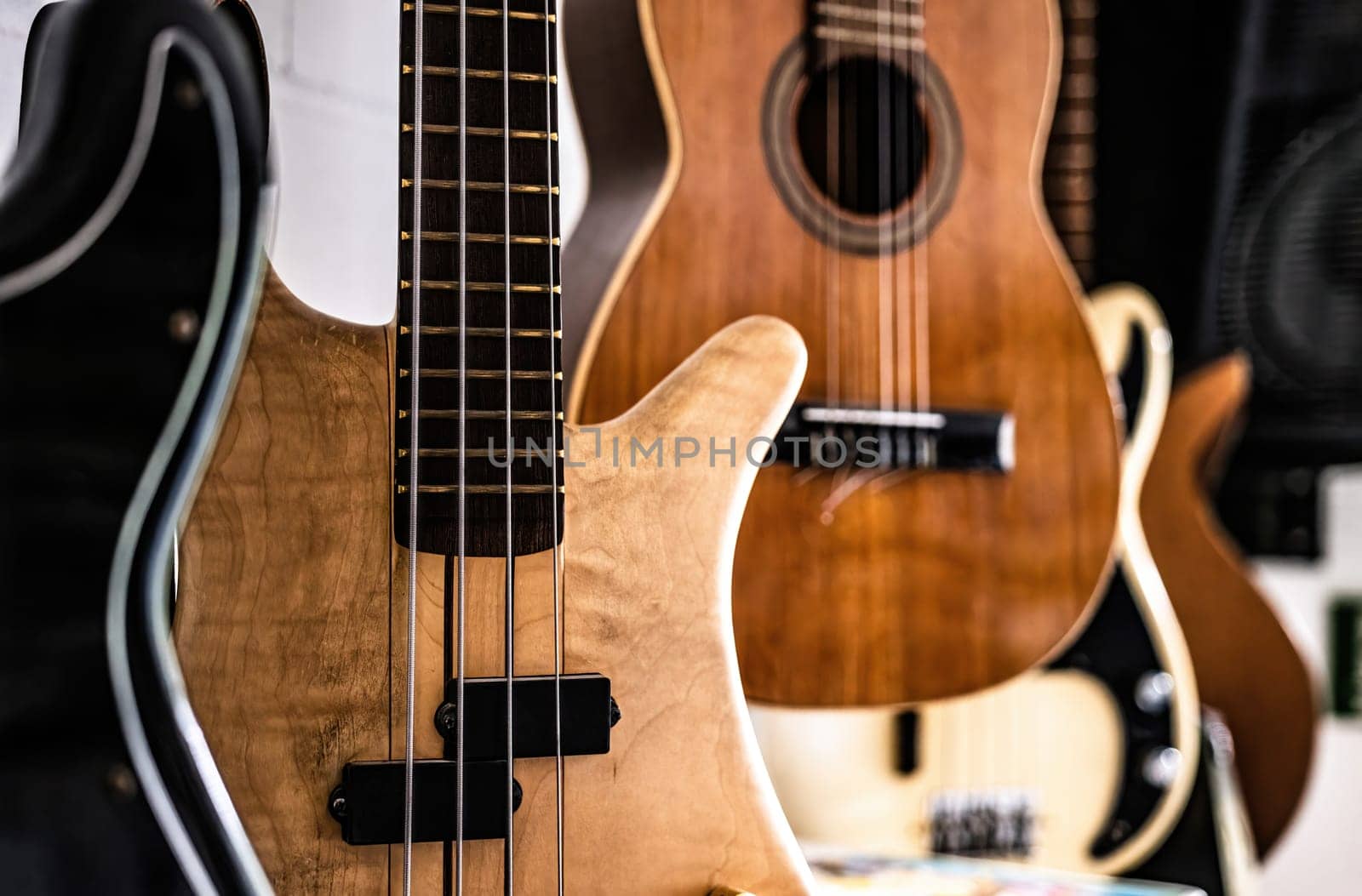 Bass guitar fretboards and strings in music recording studio closeup. Musical instrument for live acoustic perfomance