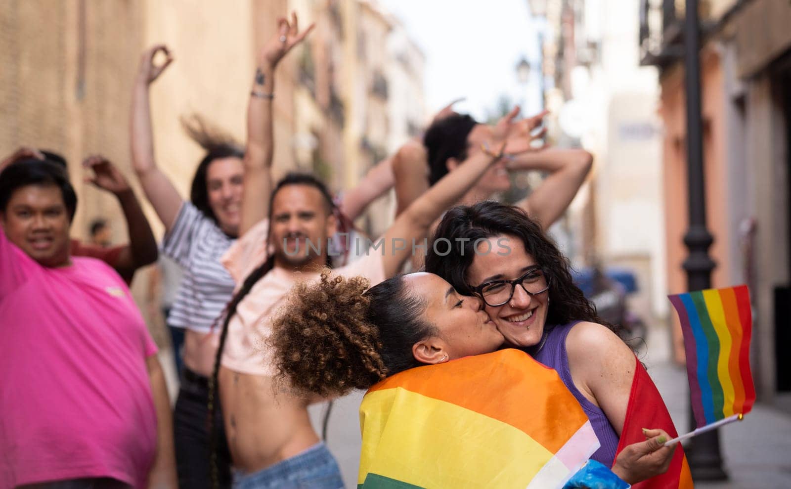 Happy LGBTQ community people enjoying and dancing on the gay parade MADO in Madrid city.