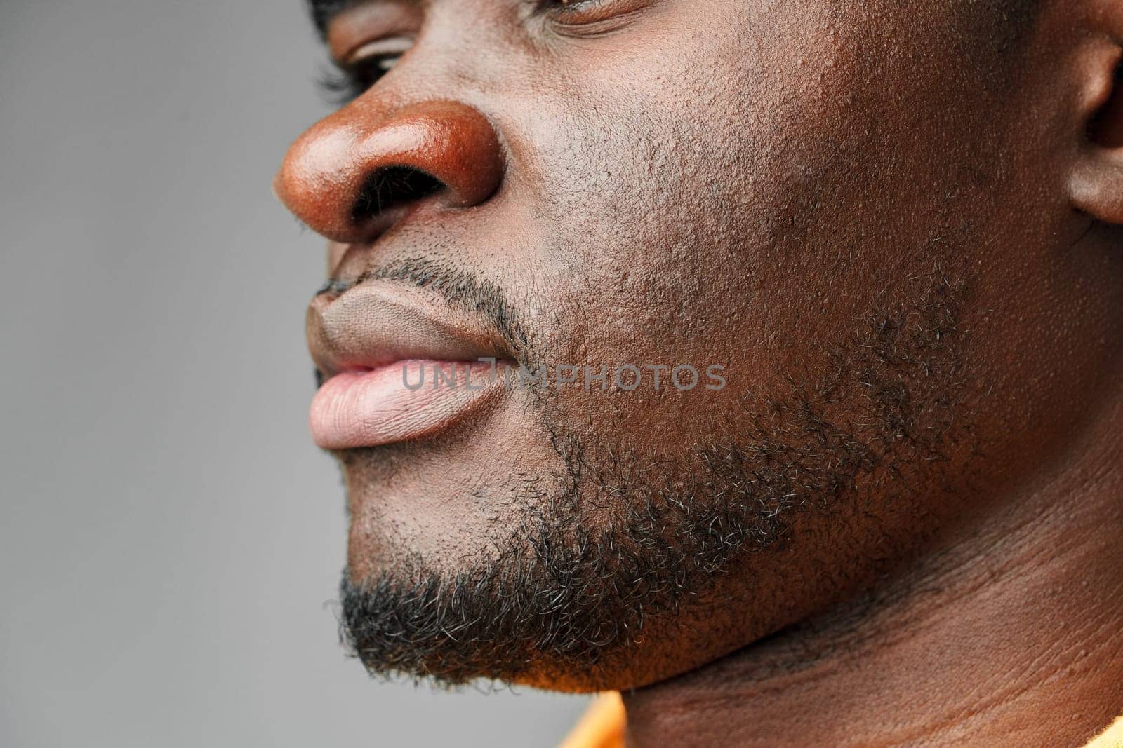 Close-Up of African Mans Lower Face and Lips studio shot