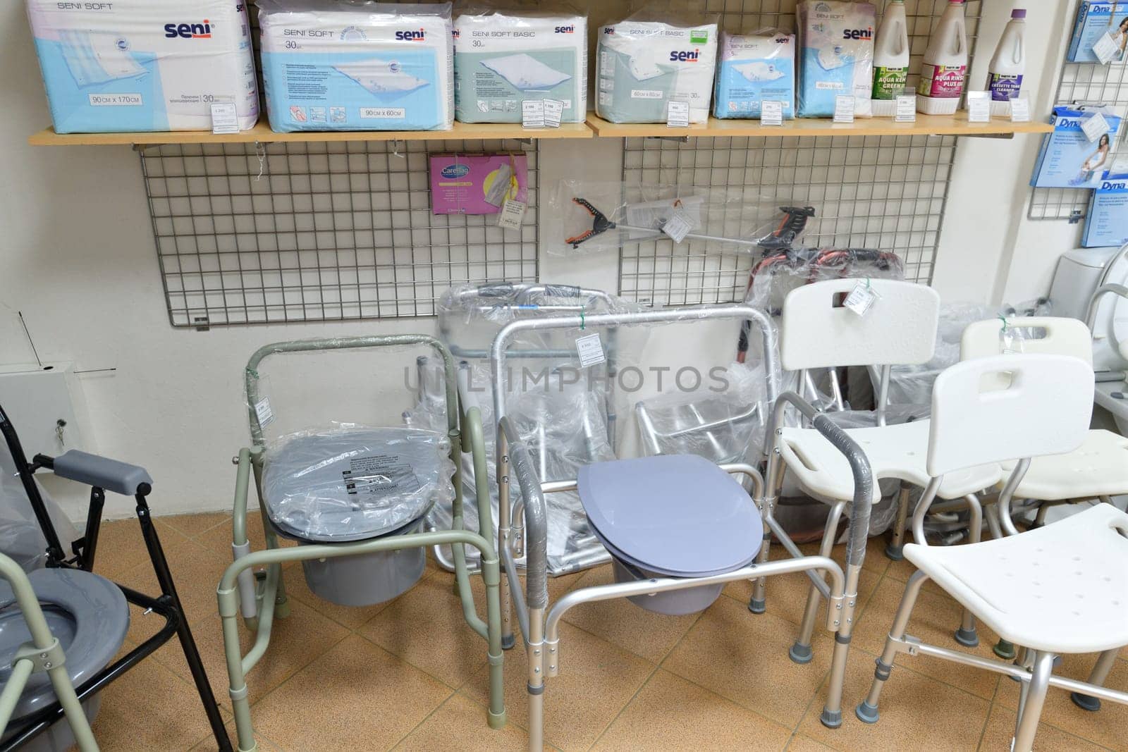 Moscow, Russia - Mar 28. 2024. folding toilet seat for the elderly in a medical store in Zelenograd by olgavolodina