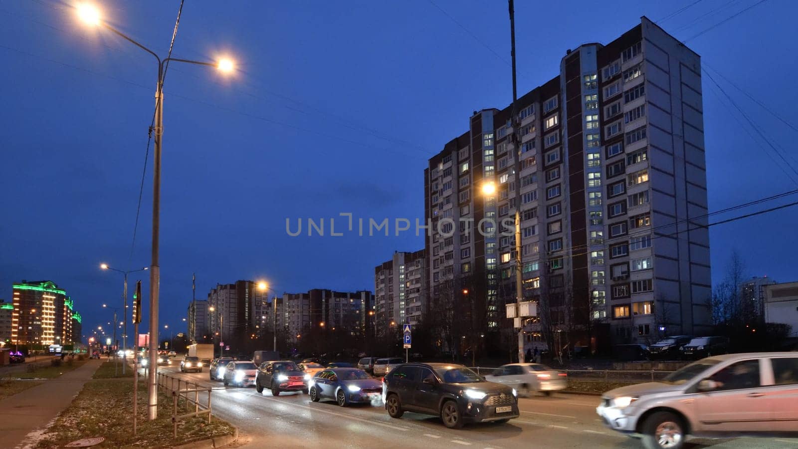 Moscow, Russia - Nov 21. 2023. Evening traffic on the Kamenka street in Zelenograd