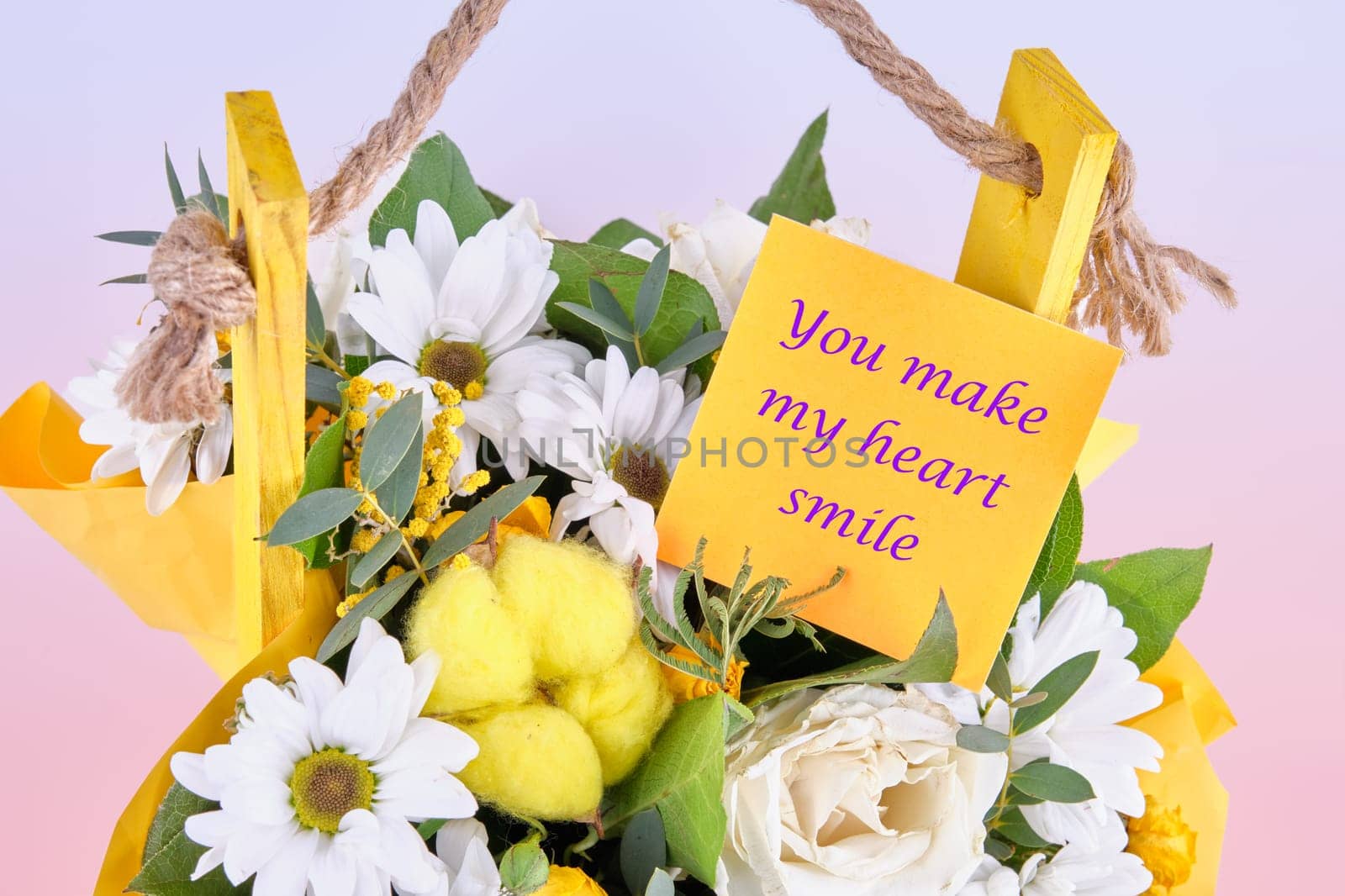 You Make My Heart Smile text on the sticker on the flowers. Concept photo