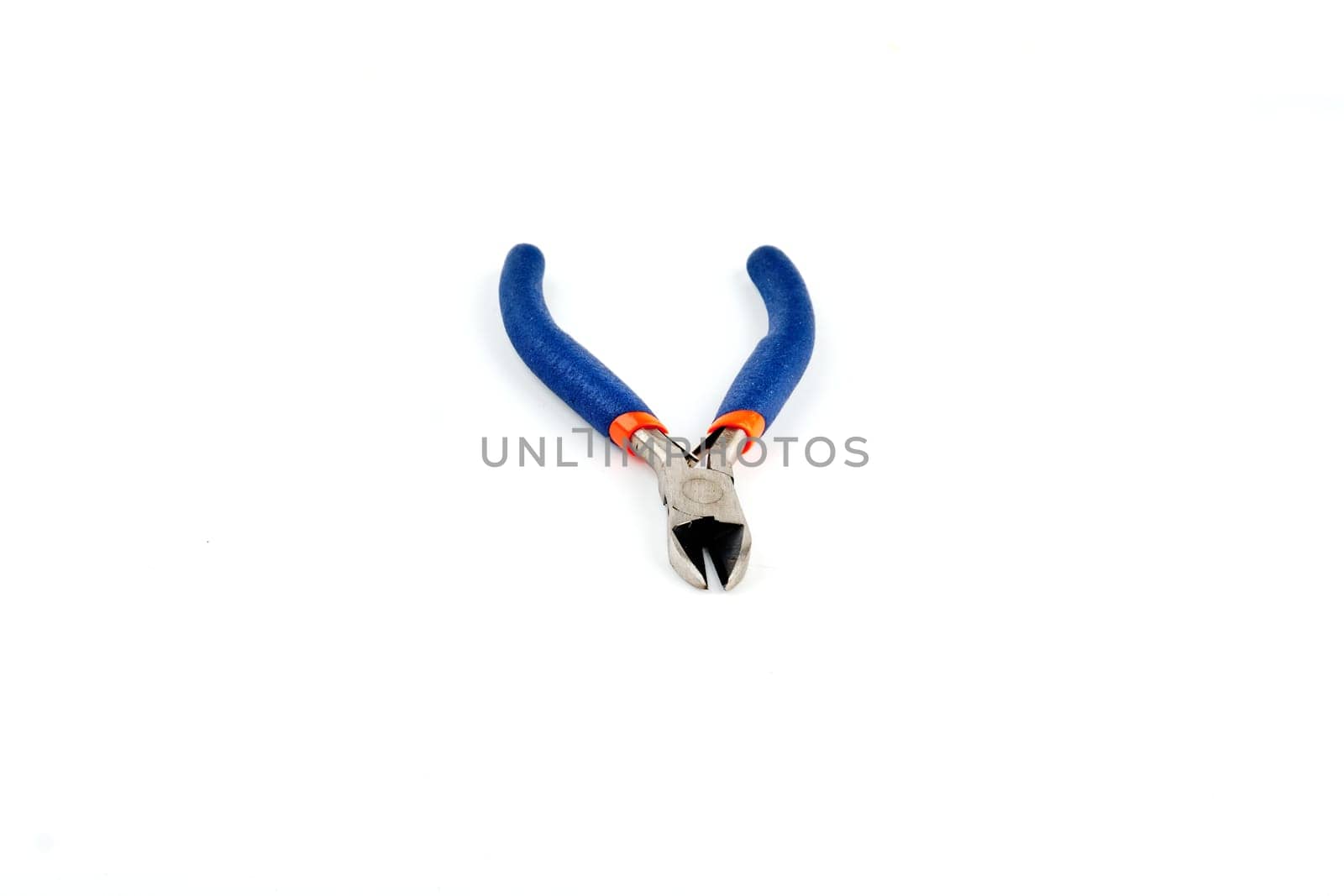 Metal wire cutting pliers are handmade equipment on a white isolate background. View from above