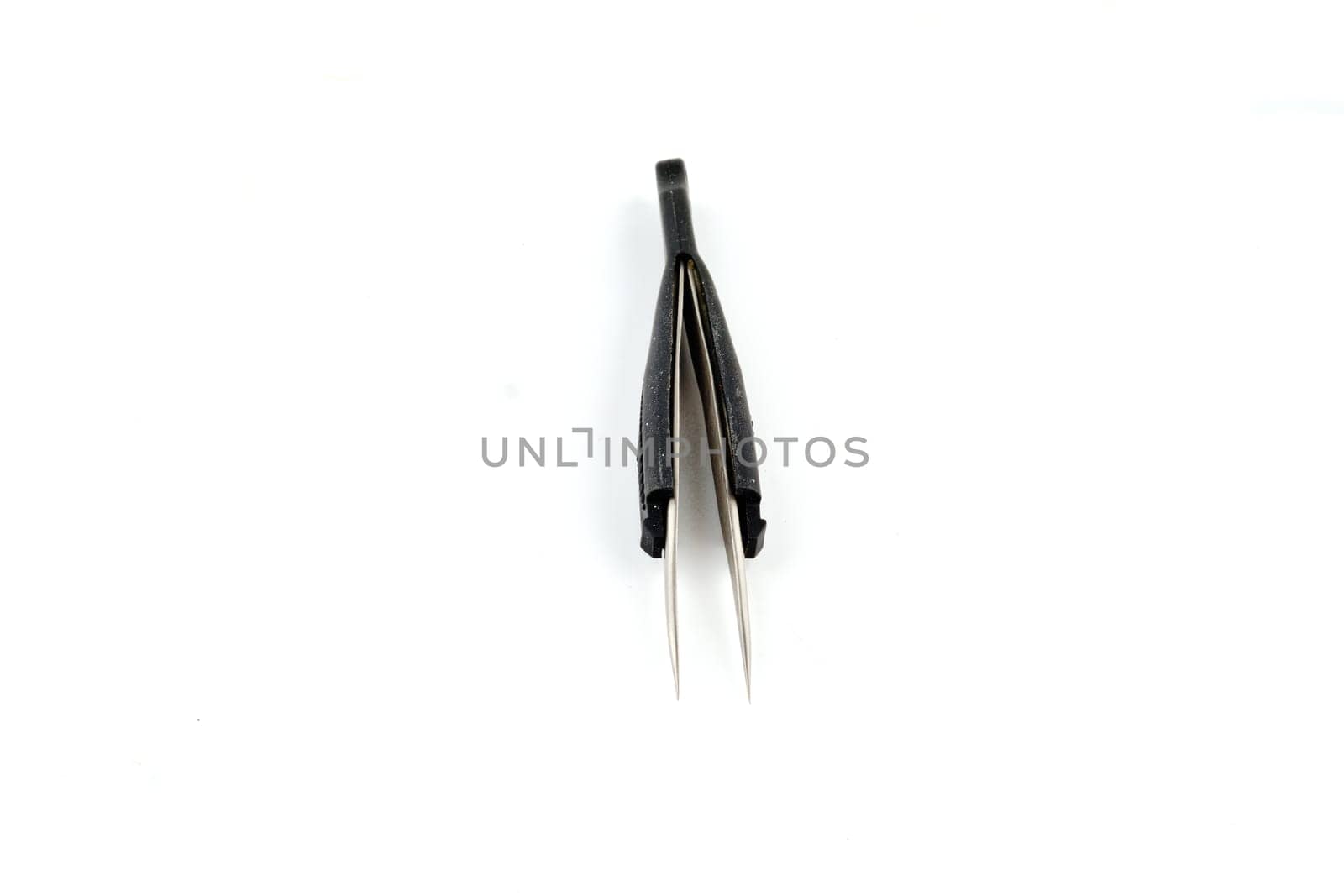 Small metal tweezers with plastic handles on a white background