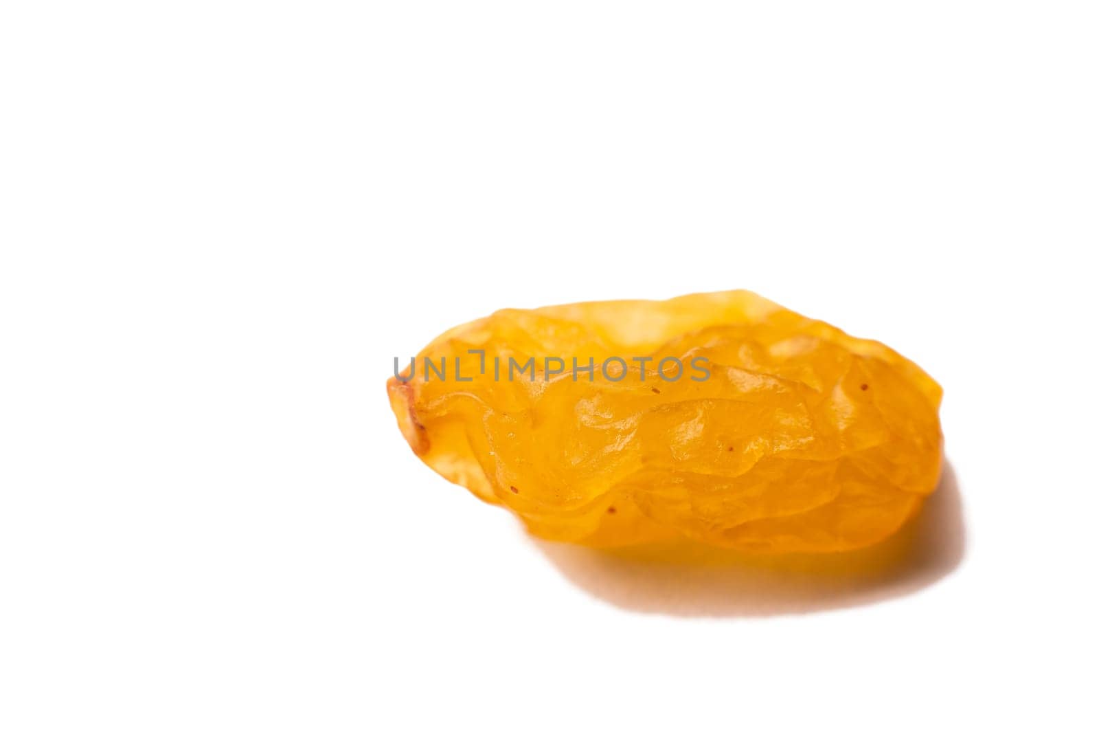 Close-up Falling yellow raisins isolated on white background with clipping path