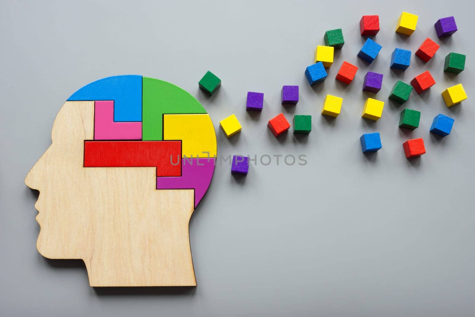 Neurodiversity concept. Head made of colored puzzles and cubes. Positivity and creativity. by designer491