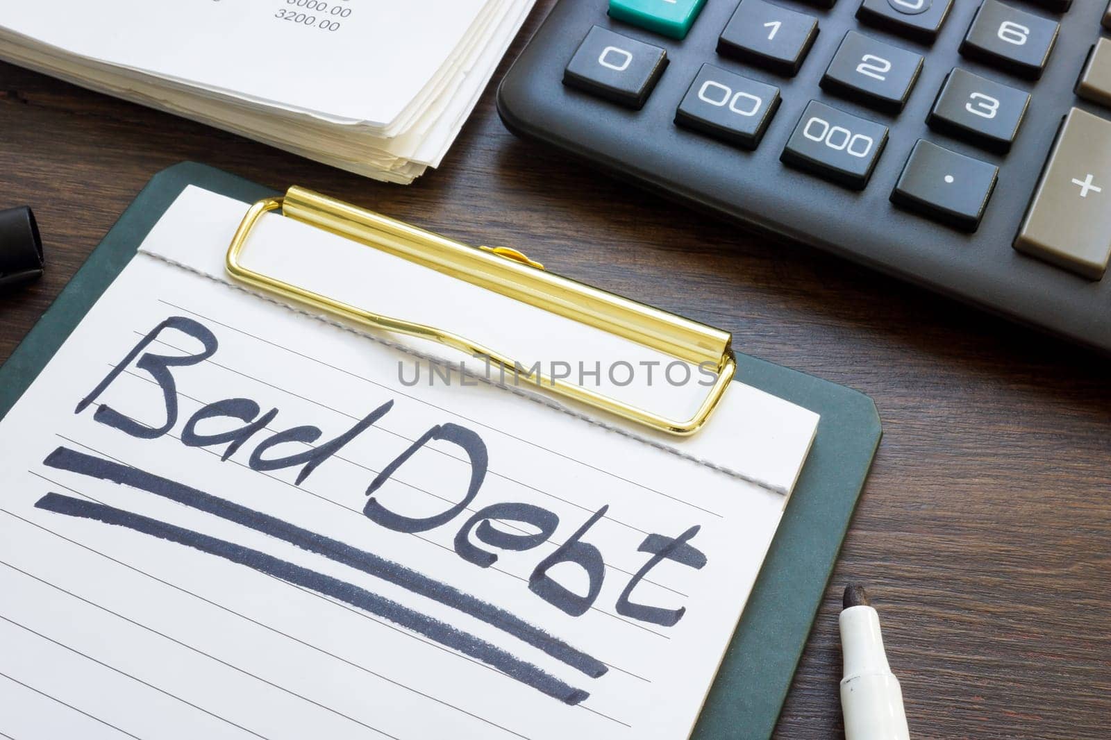 Bad debt concept. Financial report, calculator and note paper. by designer491