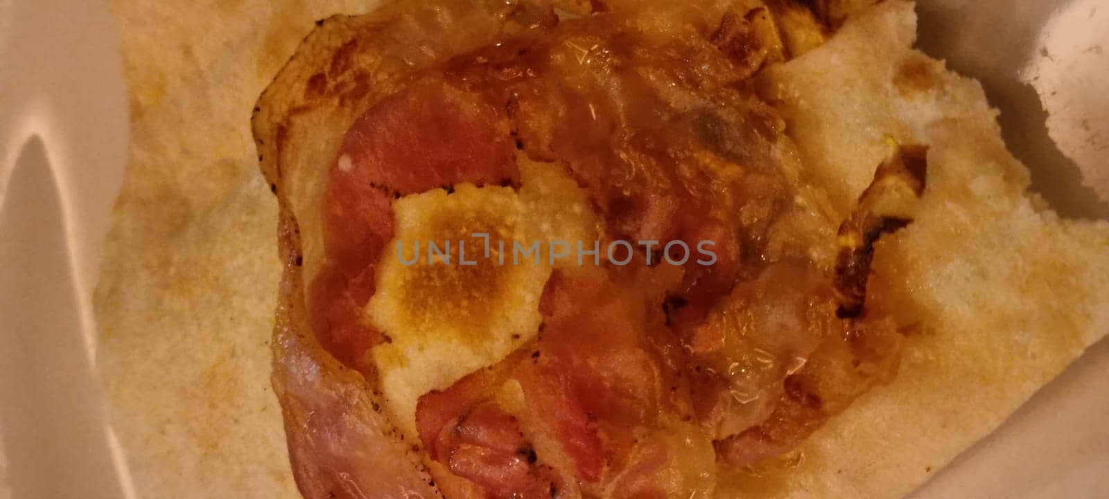 Tantalizing close-up shot capturing the melted cheese and ham on a toasted sandwich
